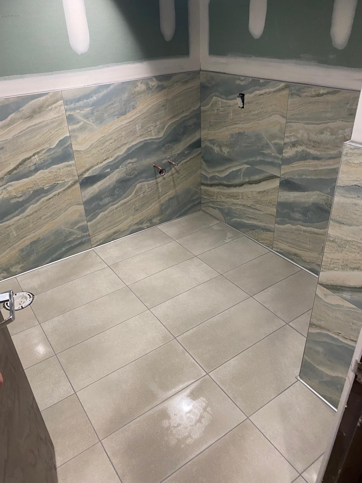 Blue and gold onyx-look large-format tile bathroom walls