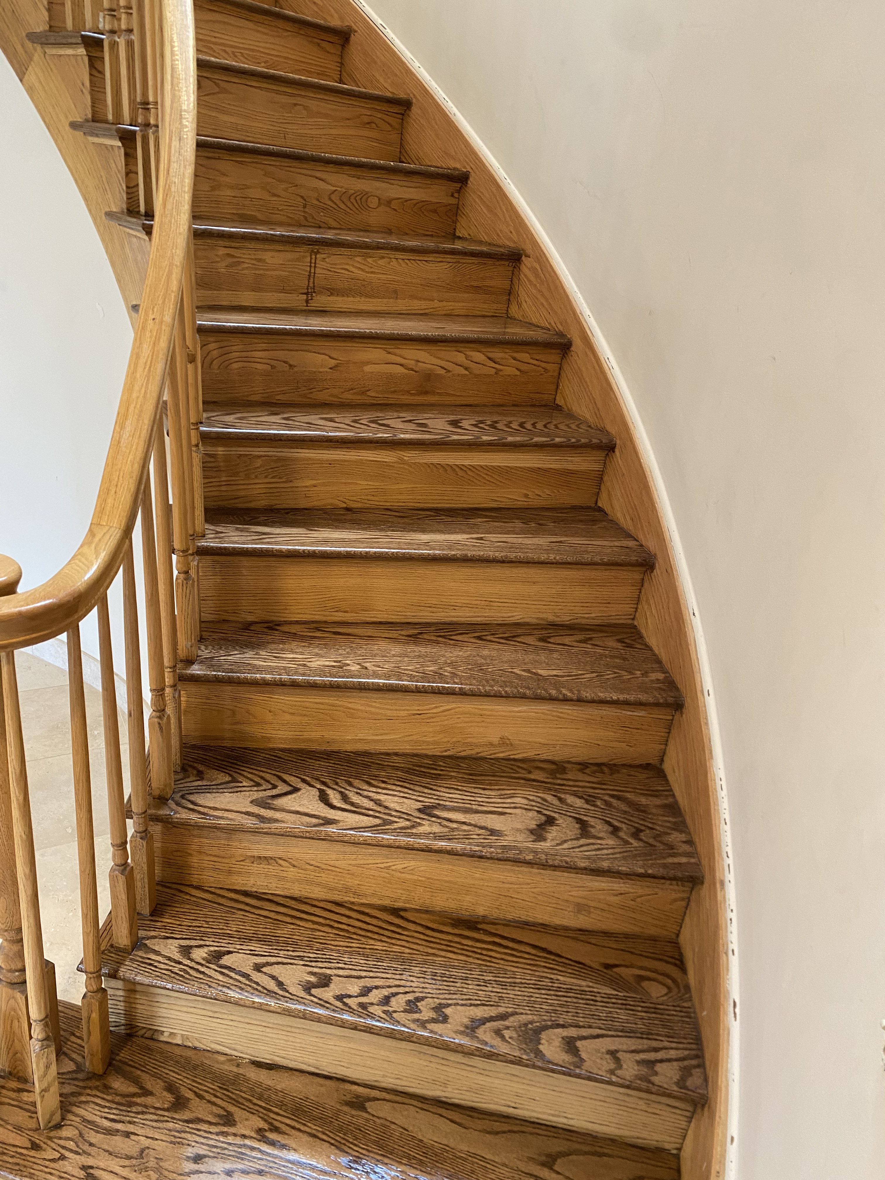 Refinished staircase with iron balusters