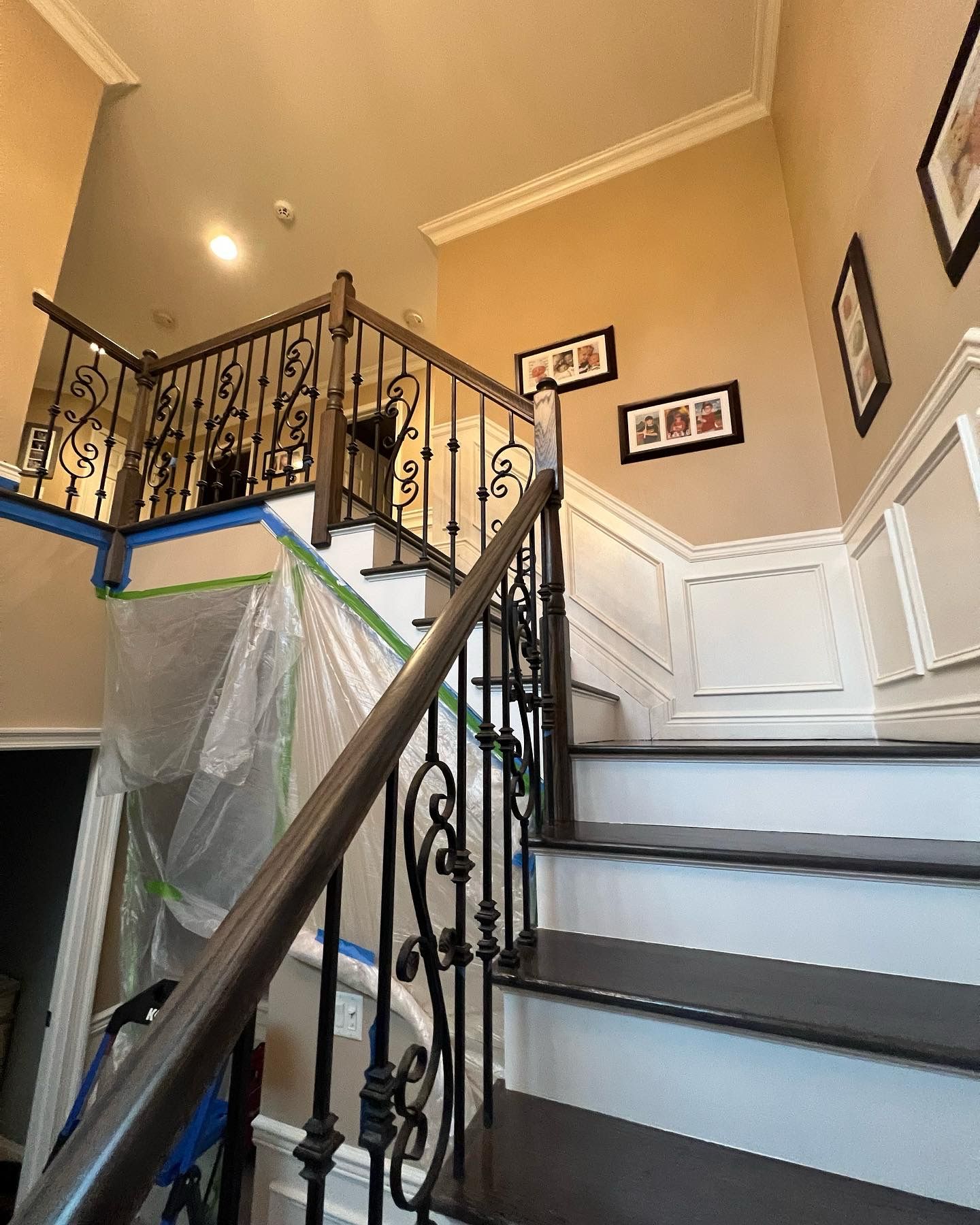 Staircase refinishing with dark stain in progress