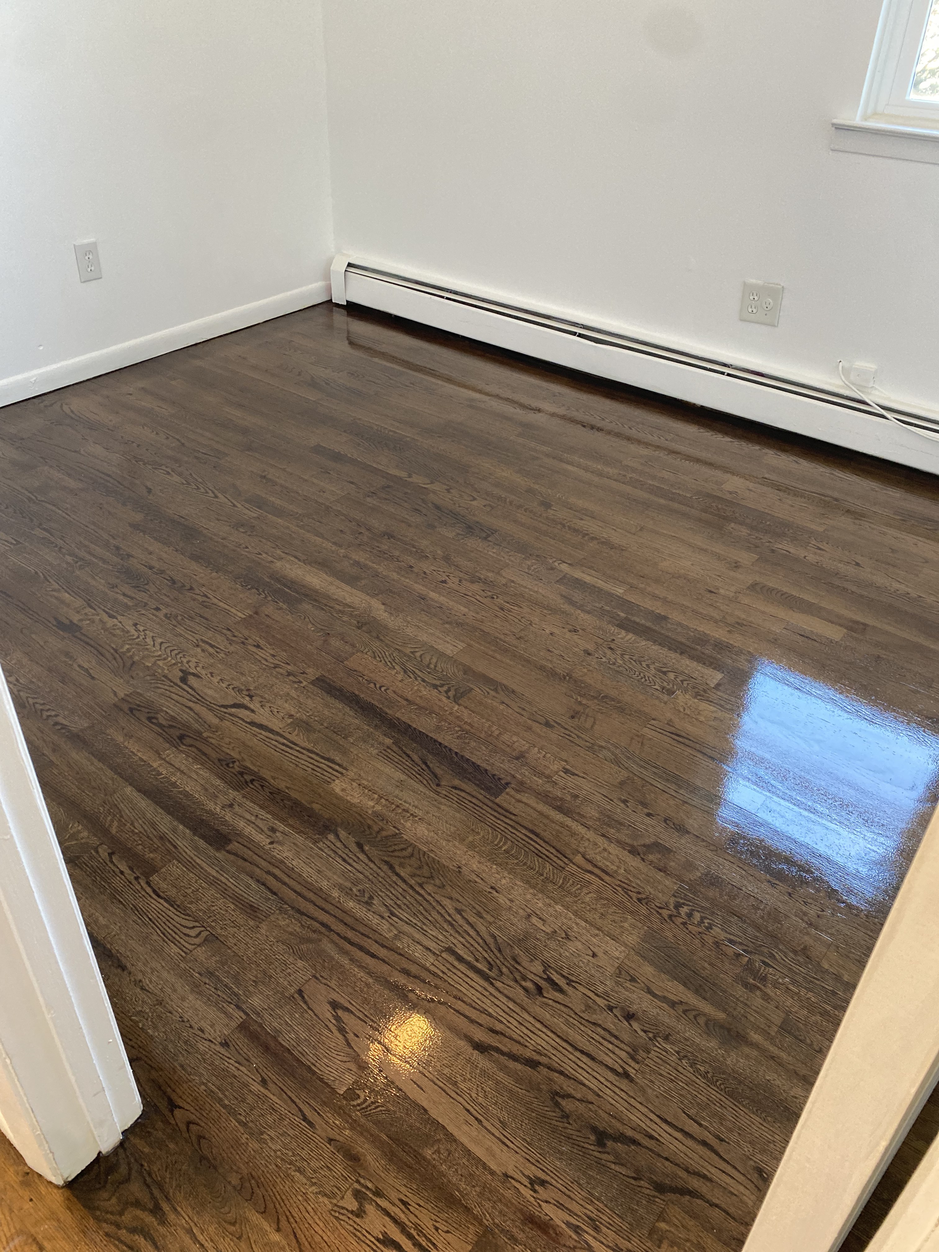 Freshly sanded and refinished red oak hardwood floor