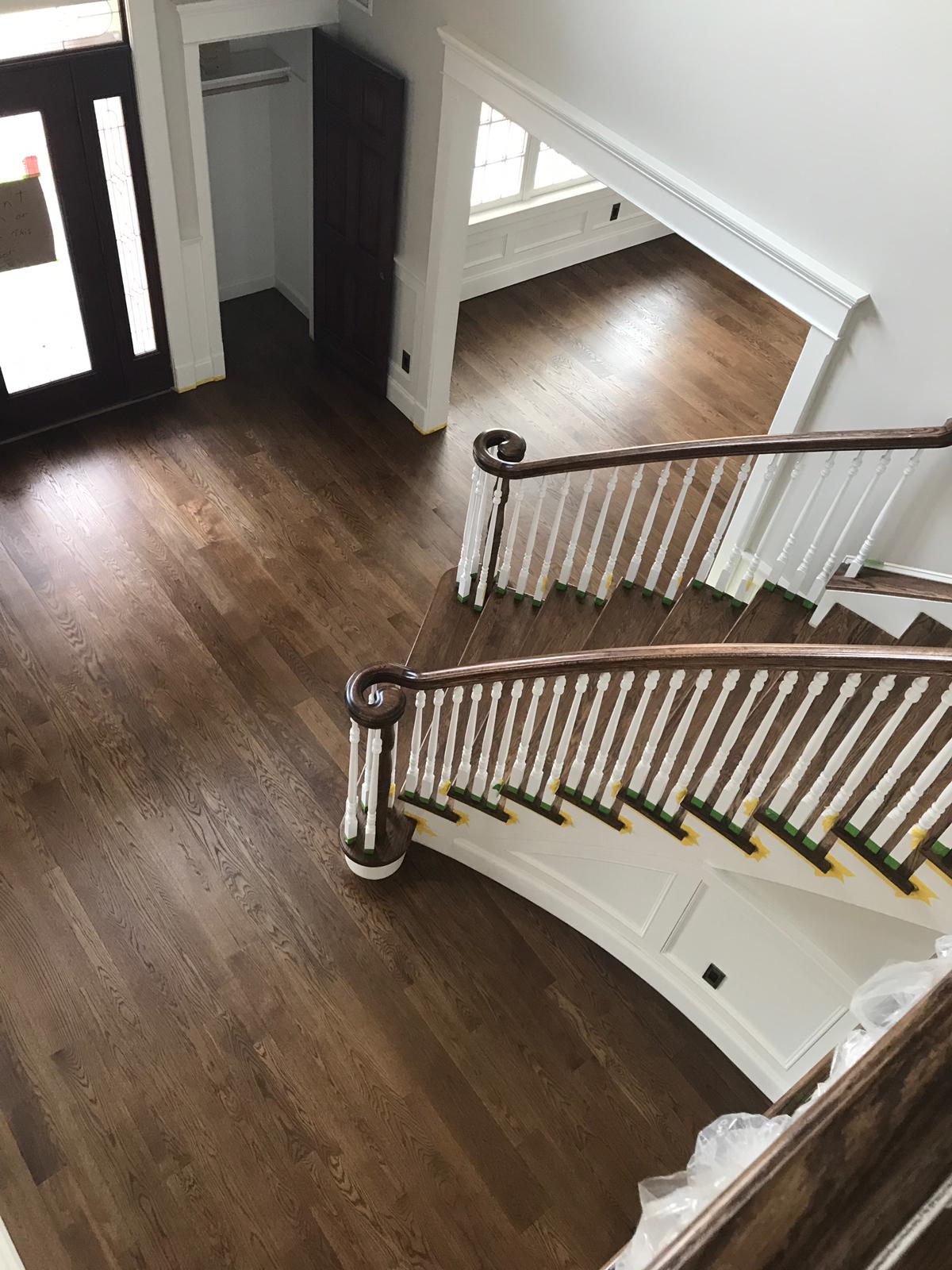 Refinished staircase with dark stained treads and white balusters