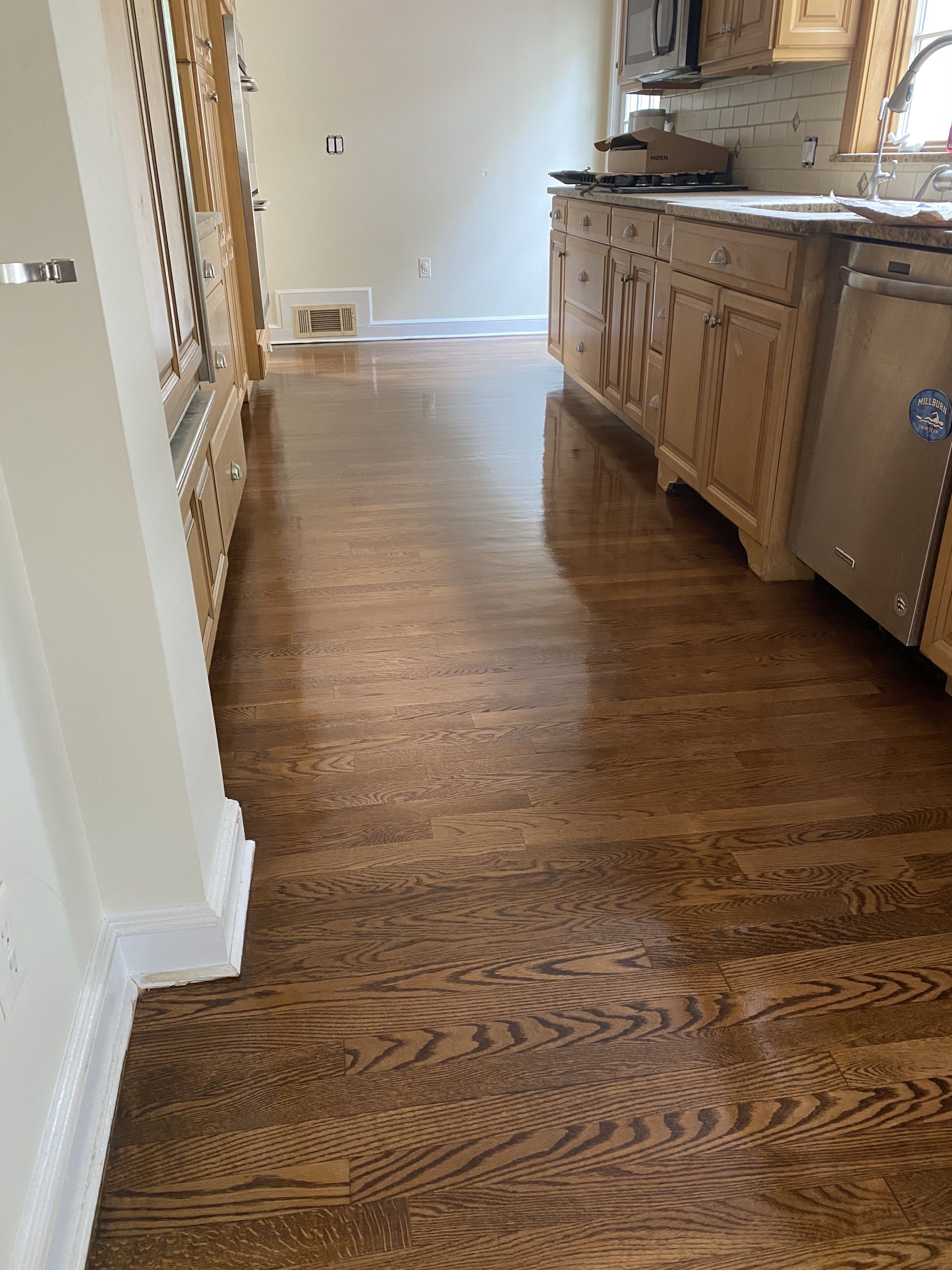 Refinished hardwood floor with fresh stain