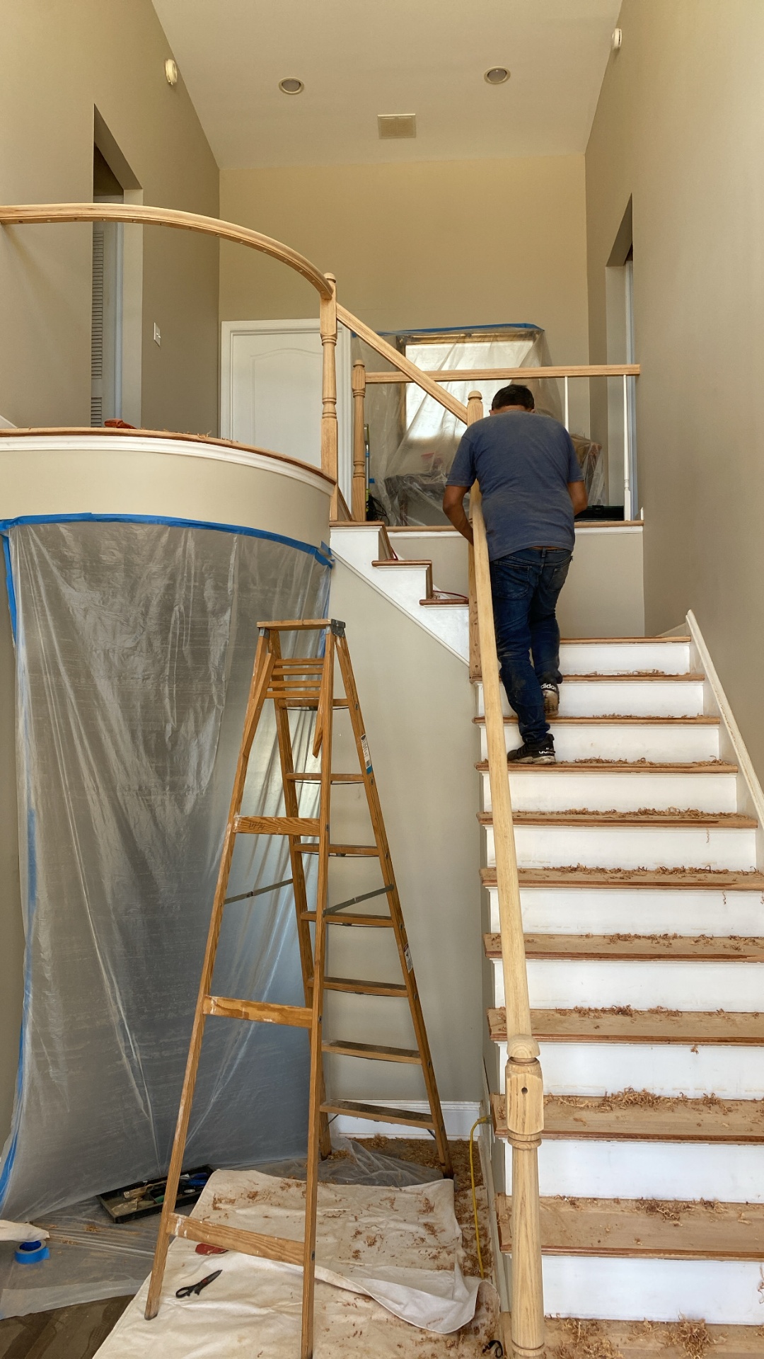 Custom curved staircase construction with new oak railing