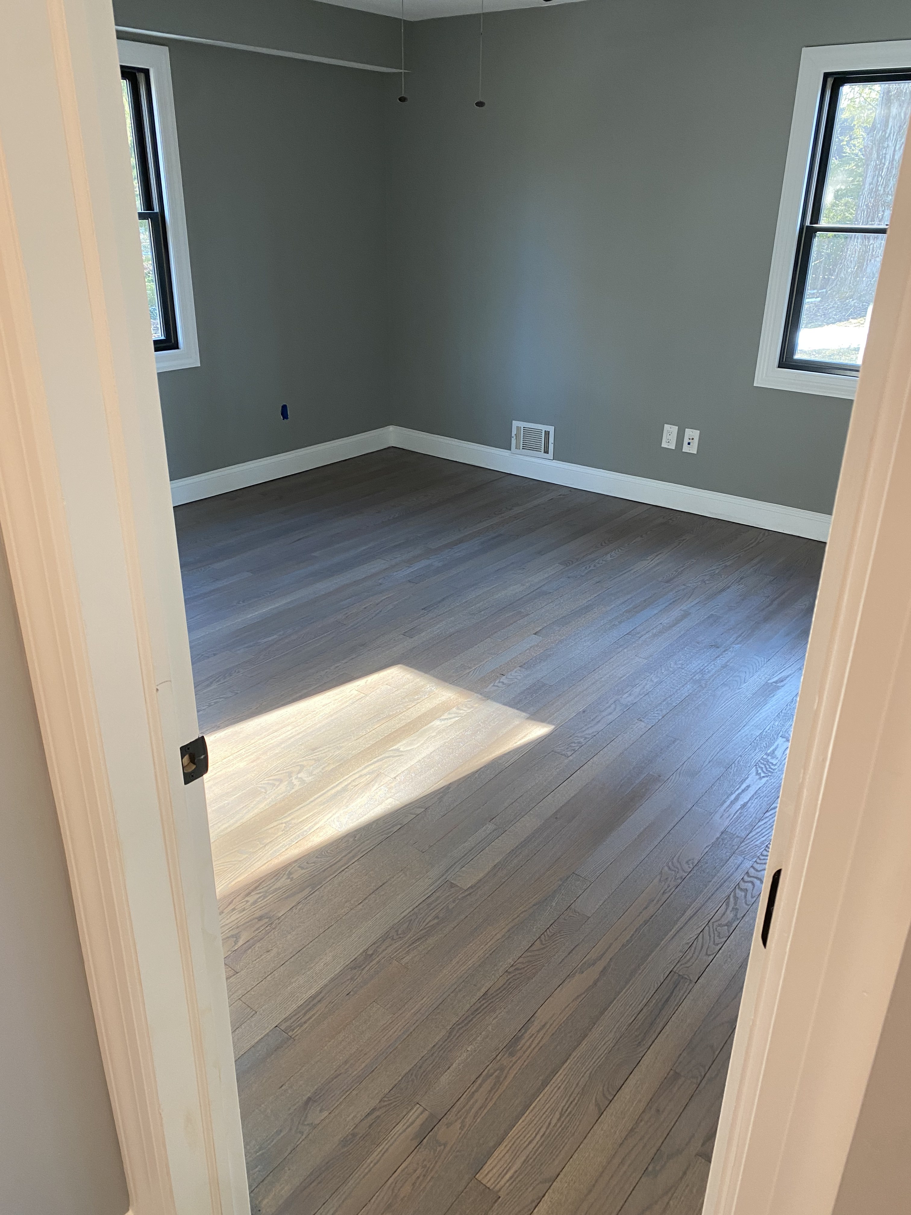Refinished hardwood floor with rich stain